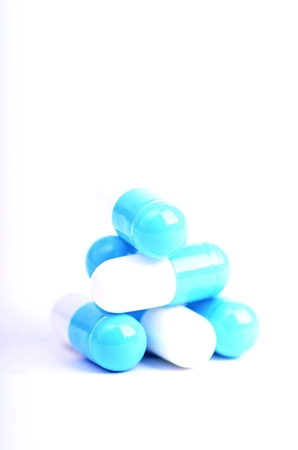 Tablets. Pills on a white background. Isolated. Building from pills. Pharmacy. Medical background. Medicine. Capsule on a spoon. close upの写真素材