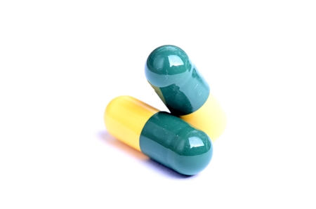 Pharmacy background. Pills isolated Medicine. white background. Capsule. close upの写真素材