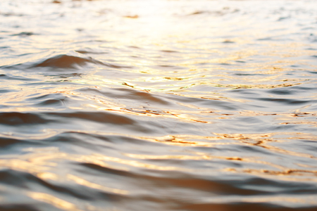 Sea wave close up. Sunset on a level of water. Ocean view seascape. Landscape. surface. Blue backgroundの写真素材