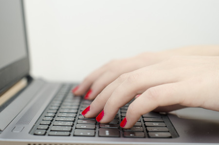 woman hand on a computer keyboardの写真素材