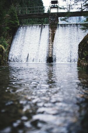 River in the middle of forest. Moody tones of forest. Cascades on the river.の写真素材