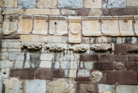 Detail of Ankaras Castle Wall with ancient walled in statues and capitalsのeditorial素材