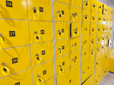 Yellow storage lockers with keys in a gym roomの写真素材