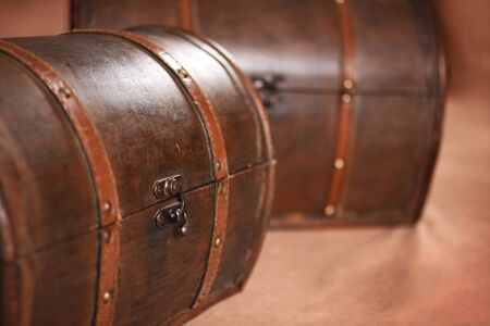 Two trunks together unfocused on brown background in photo studioの写真素材