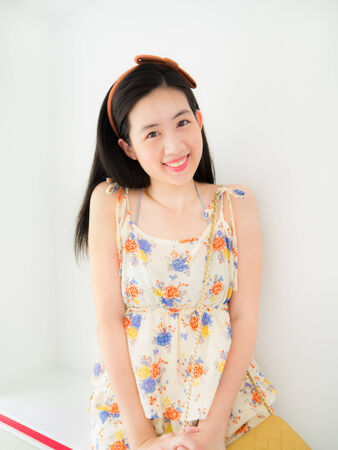 A cute asian girl in fashion dress with her beautiful smileの写真素材