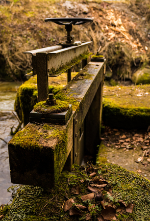 old small wooden floodgate for riverの写真素材