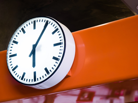 Clock on Skytrain station in Bangkok, Thailand