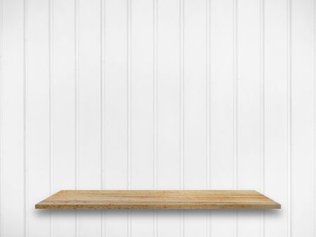 Wooden shelf for display your product on white panel wall backgroundの写真素材