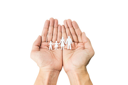 Paper cut chain family in hand isolated on white background with clipping pathの写真素材