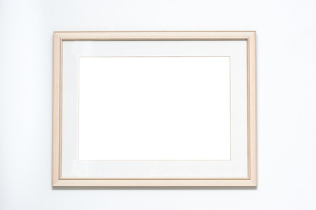 Blank picture frame on white wall backgroundの写真素材