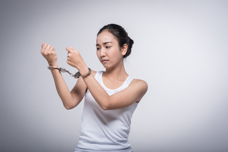 Sad woman with handcuffs.Stop Violence and abuse with woman concept.の写真素材
