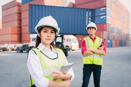 Staff and foreman control loading container cargo in logistic, export, import industry with forklift...