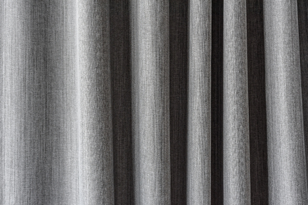 Close up shot of grey fabric curtain texture background