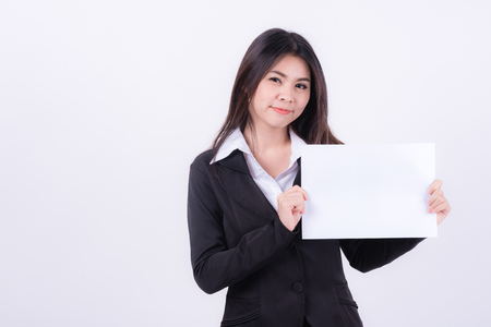 Attractive young beautiful Asian businesswoman holding blank white paper の写真素材