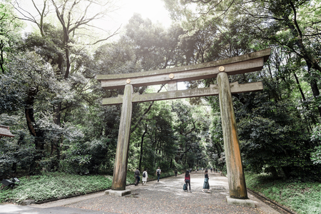 Tokyo, Japan - April 15, 2018: Torii gate in Yoyogi park to entrance meiji shrine located adjacent to Harajuku Station.のeditorial素材