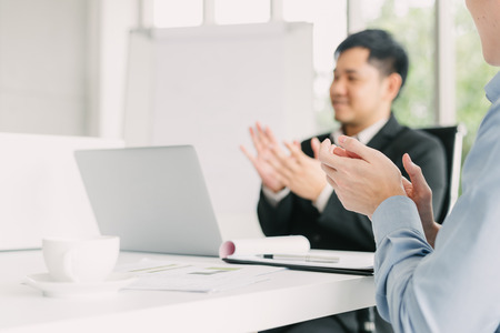 Hand of businessman applauding after success business meeting presentationの写真素材