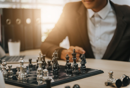 Cofident business man playing chess. business strategic conceptの写真素材