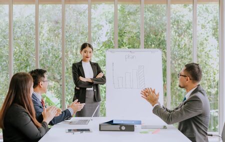 Great and success presentation, young confident Asian woman standing near flipboard and smiling...