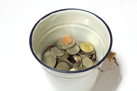 Coins in a steel tankの写真素材