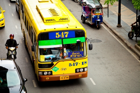 BANGKOK - JUN 17: Public car while stuck on the downtown streets of Bangkok. on Jun 17, 2013 in Bangkok, Thailand.のeditorial素材