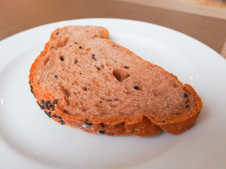 whole grain bread slice on white dish
