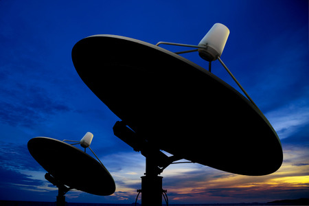 Satellite antenna in twilightの写真素材