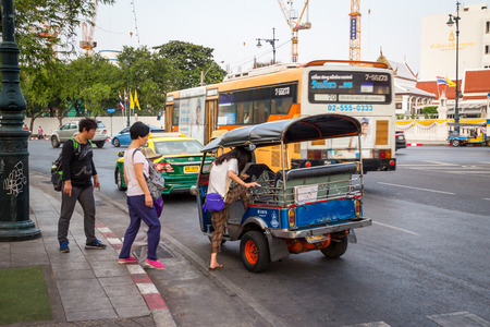 BANGKOK,THAILAND DEC 12: Chinese tourists are get up on tuk-tuk for sightseeing on DECEMBER 12, 2014...