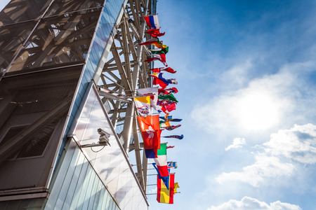 NAMISEOM - March 06: Jara-Nami skyline tower with international flags in front of the gate pier to...