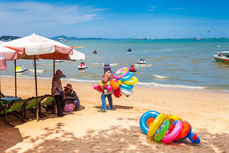 PATTAYA THAILAND  MAY 2 : Local merchant selling colored ring to tourists at Pattaya beach. on May 2 2015 Pattaya Thailandのeditorial素材