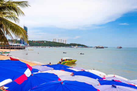 PATTAYA THAILAND  MAY 2 : Colorful umbrella on the beach and tourists playing and relaxing at Beach. on May 2 2015 Pattaya Thailandのeditorial素材