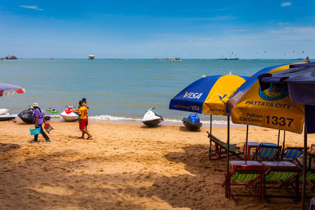 PATTAYA THAILAND  MAY 2 : Colorful umbrella on the beach and tourists playing and relaxing at Beach. on May 2 2015 Pattaya Thailandのeditorial素材