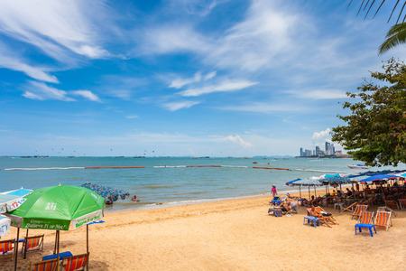 PATTAYA THAILAND  MAY 2 : Colorful umbrella on the beach and tourists playing and relaxing at Beach. on May 2 2015 Pattaya Thailandのeditorial素材