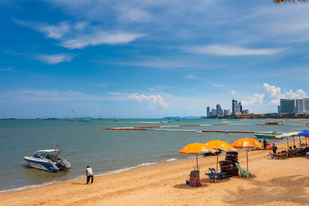 PATTAYA THAILAND  MAY 2 : Colorful umbrella on the beach and tourists playing and relaxing at Beach. on May 2 2015 Pattaya Thailandのeditorial素材
