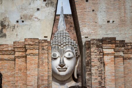Ancient buddha statue. Phra Achana, Wat Si Chum Si Chum temple, Sukhothai Historical Park, Sukhothai Province, Thailandの写真素材
