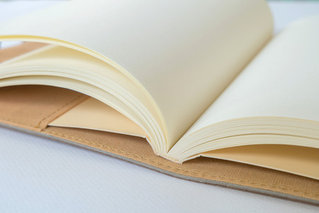 Blank Notebook on a White Paper Backgroundの写真素材