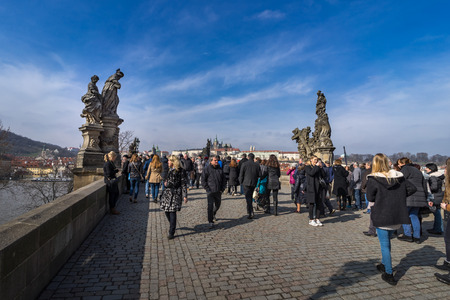 PRAGUE, CZECH REPUBLIC - MARCH 5: Many activites on Charles Bridge in the holiday. Charles Bridge is over Vltava river in Prague, Czech Republic. on March 5, 2016のeditorial素材