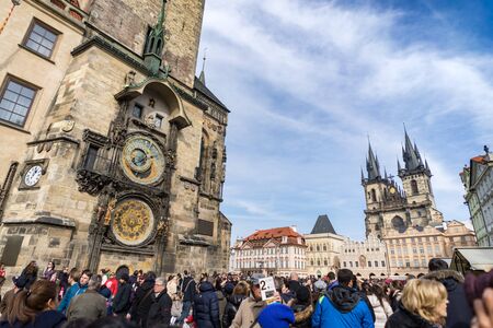 PRAGUE, CZECH REPUBLIC - MARCH 5, 2016: Unidentified tourists in the Old Town Square in front of Tyn Church and famous Astronomical Clock, Prague Czech, on March 5, 2016のeditorial素材