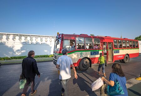 Bangkok, Thailand - April 8: People getting on the bus opposite the grand palace. on April 8, 2016 in Bangkok, Thailand.のeditorial素材