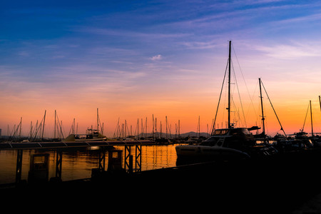 Silhouette sailing boats in Sunset.の写真素材