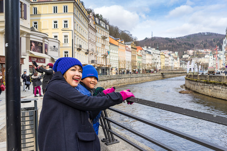 PRAGUE, CZECH REPUBLIC - MARCH 4, 2016: Asian boy and mom are travel in termal mineral spring in Karlovy Vary, Czech Republic on March 4, 2016のeditorial素材