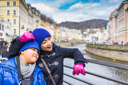 PRAGUE, CZECH REPUBLIC - MARCH 4, 2016: Asian boy and mom are travel in termal mineral spring in Karlovy Vary, Czech Republic on March 4, 2016のeditorial素材