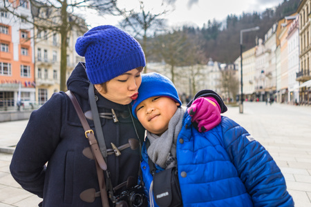 PRAGUE, CZECH REPUBLIC - MARCH 4, 2016: Asian boy and mom are travel in termal mineral spring in Karlovy Vary, Czech Republic on March 4, 2016のeditorial素材