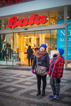 PRAGUE, CZECH REPUBLIC - MARCH 5, 2016: Asian boy and mom are travel in old town on Prague, Czech Republic. on March 5, 2016のeditorial素材