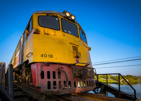 KANCHANABURI, THAILAND - December 29, 2016: Train go on the bridge of river Kwai in Kanchanaburi, Thailand. The bridge was built by the Japanese Army during World War II. Nowadays is a famous tourist destination of the world.のeditorial素材