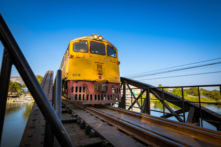 KANCHANABURI, THAILAND - December 29, 2016: Train go on the bridge of river Kwai in Kanchanaburi,...
