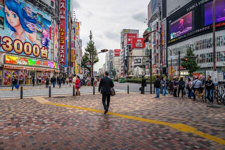 Tokyo, Japan, October 15, 2018: City street with crowd people on zebra crosswalk in Shinjuku town. Shinjuku is a special ward located in Tokyo for shoppingのeditorial素材