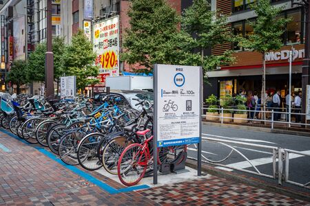 Tokyo, Japan, October 15, 2018: People are parking their bicycle near a street in Shinjuku town. Shinjuku is a special ward located in Tokyo for shopping.のeditorial素材