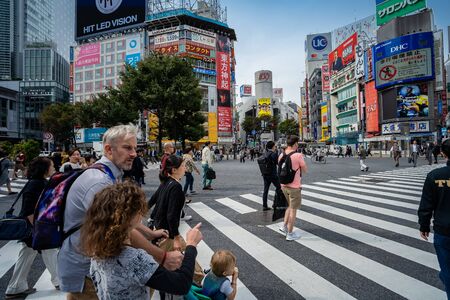 SHIBUYA, TOKYO, JAPAN - OCTOBER 16, 2018: Shibuya Crossing, One of the world's most used pedestrian scrambles, at Hachiko Square in Shibuya,のeditorial素材