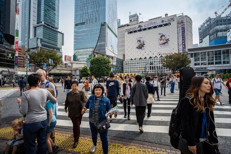 SHIBUYA, TOKYO, JAPAN - OCTOBER 16, 2018: Shibuya Crossing, One of the world's most used pedestrian scrambles, at Hachiko Square in Shibuya,のeditorial素材