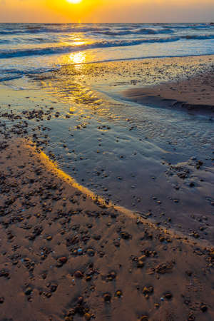 Beautiful sea waves in the morning sunrise.の写真素材